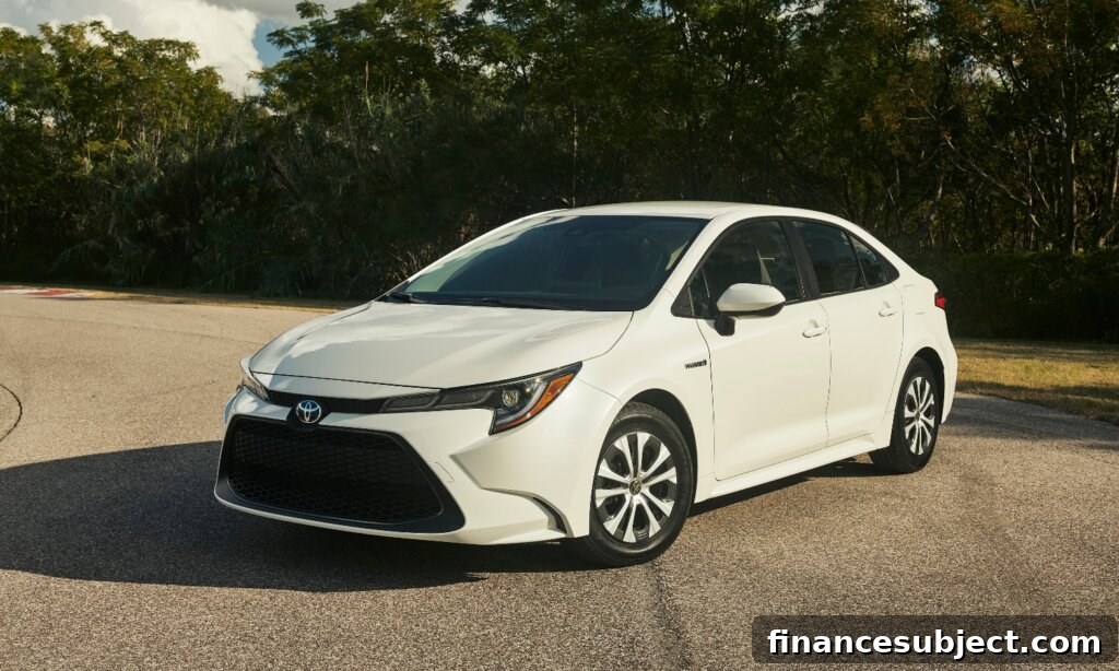 A white Toyota Corolla Hybrid parked in a lot