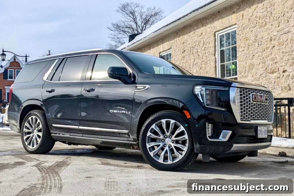A GMC Yukon Denali sport utility vehicle on a driveway