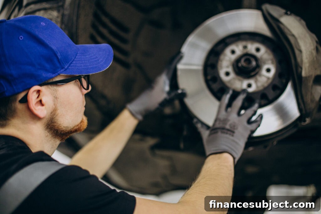 A mechanic installs a tire on a car