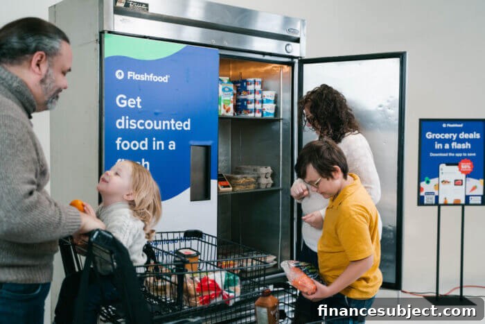 A family picks up discounted items from a Flashfood fridge in a grocery store.