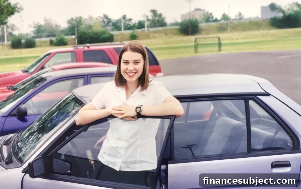 A smiling young woman beside a small, purple Subaru Justy car