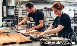 Two food service workers in a kitchen: one of the industries with signs of unemployment