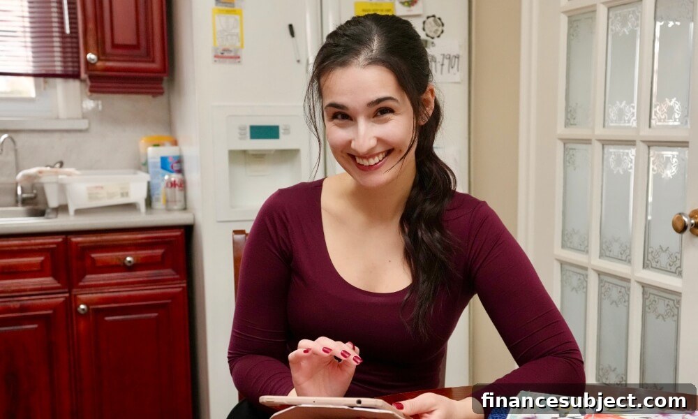 Photo of Diana Skakavac in her kitchen holding a tablet